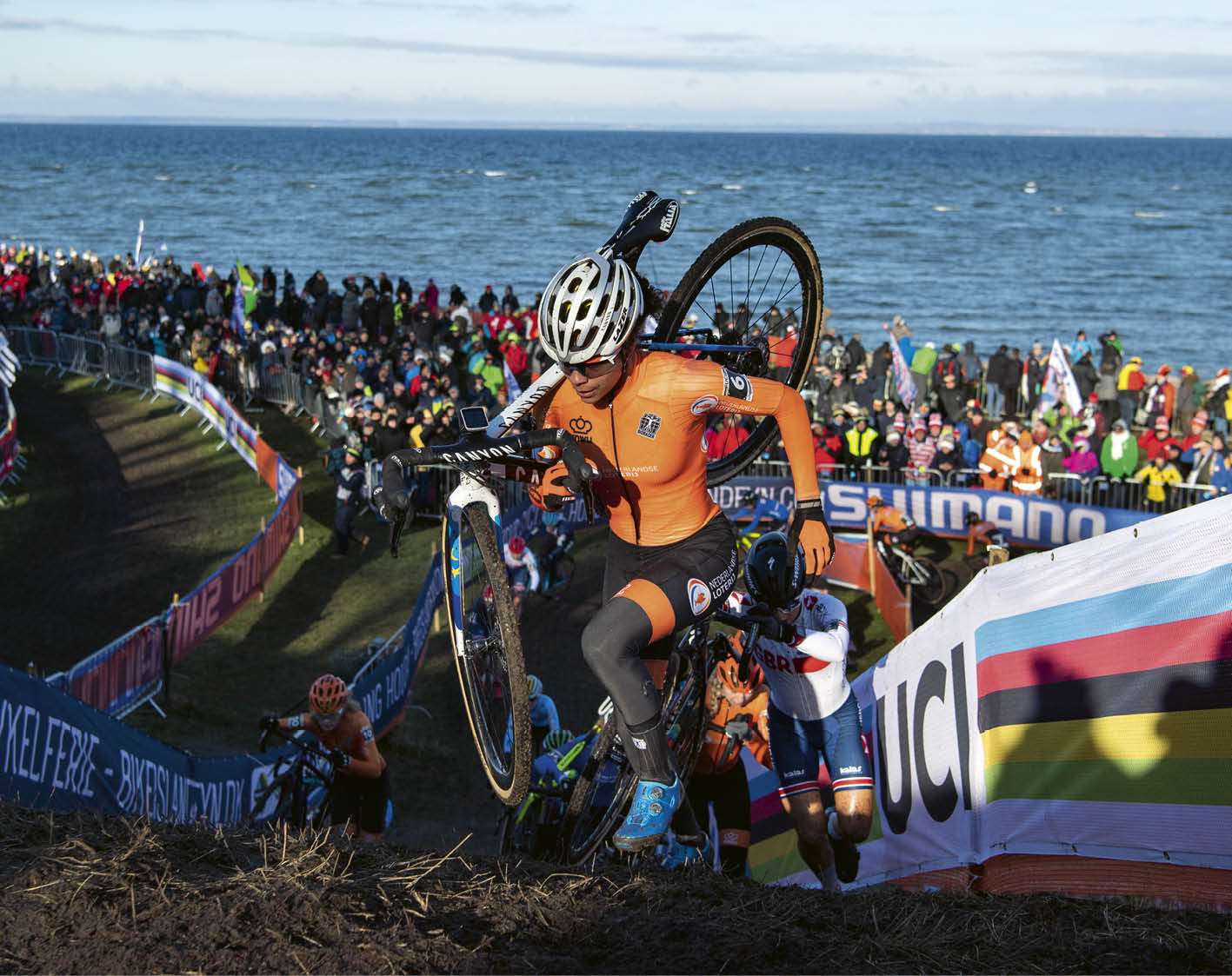 A man riding a bike on a course. Description generated by AI